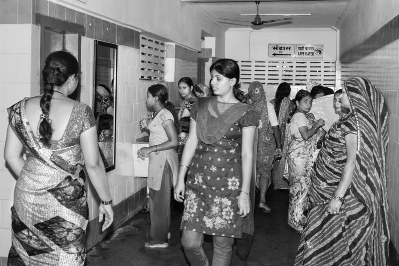 Women and girls using the ladies toilet block in the community toilet-cum-bath complex constructed by Sulabh International in Shirdi, Maharashtra